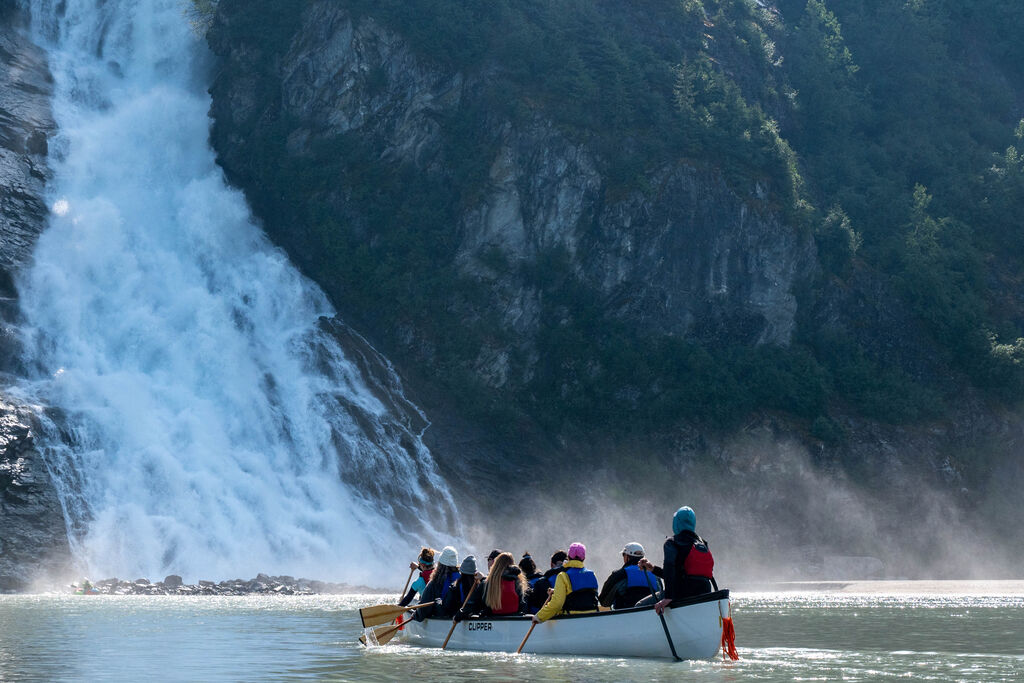 Canoe Commute - Glacier Guides take the helm en route to the Mendenhall Glacier