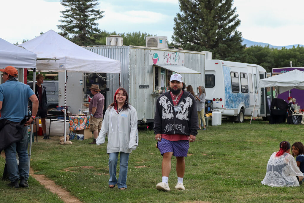 Staff relax by food trucks during the September music festival