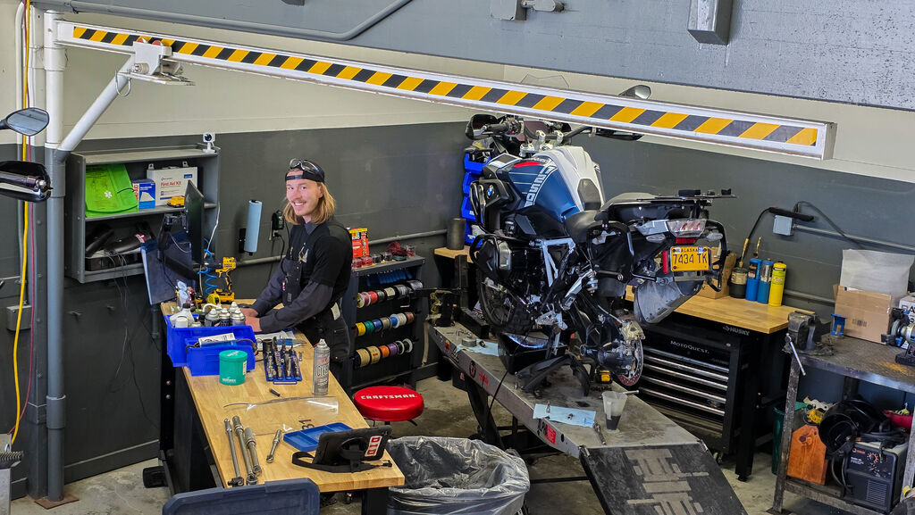 The Lien Machine servicing a bike for it's next adventure